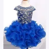 Underbara Royal Blue Girls Pageant Dresses Ball Gown Beads Crystals Cupcake Ruffles Tutu kjol Kort barn formella festklänningar240z