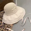 Sommarkvinnor hink hatt designer brett grim sunbonnet för kvinna vikbar virkning stickad stråhatt utomhus strand sol mössa gräs flätor mössor