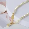 Trendy Jewelry Saturn Pearl with Enamel Tridimensional Lock Necklace for Women2383