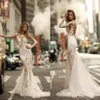 2018 Splendidi abiti da sposa a sirena Sexy maniche lunghe trasparenti Abito da sposa con applicazioni di pizzo pieno Vedere attraverso abiti da sposa senza schienale3091