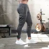 Mężczyzn Pants Fitness European i amerykańskie sporty sportowe spodnie na świeżym powietrzu prowadzące trening elastyczny 230721