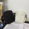 Kvällspåsar duk kvinnors crossbody väska trend 2023 Oxford axel handväska koreansk solid färg studenttelefon enkel shoppare handväska