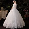 2023 Vestidos de Noiva de Renda Africana Puro Pescoço Ilusão Manga Longa Botões Bufantes Vestidos De Noiva Cristal Frisado Diamante Luxo Formal Novos Vestidos de Noiva elegantes