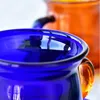 Чашки блюдцы 250 мл разноцветные стеклянные чашки с теплостойкой кофейной блюдкой Установите европейское сок капучино домашнее кафе Офисная посуда