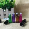 卸売価格4色5mlカラフルなガラスボトルとスチール製のボトルはアイクリーム、香水、エッセンシャルオイル、リップグロスボトル180 CLCTのためにロールロールします