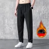 Pantaloni da uomo Pantaloni sportivi in pile caldo con tasche Pantaloni sportivi Jogger da allenamento con coulisse invernale Taglie forti Dritto