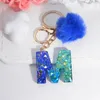 Keychains Exquisite Blue Pompom A-Z 26 Letter Keychain Glitter Heart Sequin Filled Initials Keyrings Bag Accessories Charm Car Keyholder
