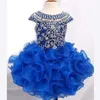 Underbara Royal Blue Girls Pageant Dresses Ball Gown Pärlor Crystals Cupcake Ruffles Tutu kjol Kort barn formella festklänningar304h