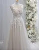 Popular Deep V Neck Applique A Line Sleeveless Champagne Wedding Dresses Sweep Train Sexy Backless Bridal Dress Soft Tulle Beach Wedding Gowns Vestidos de Novia