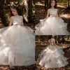 Gelaagde rok bloemenmeisje jurk kralen kant holle rug jurk voor bruiloft op maat gemaakte vloer lengte boog mooie baby dresses233y