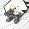Chien Design voiture porte-clés sac pendentif breloque fleur porte-clés porte-anneau pour femmes hommes mode Pu cuir Animal chaîne accessoires