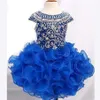 Underbara Royal Blue Girls Pageant Dresses Ball Gown Pärlor Crystals Cupcake Ruffles Tutu kjol Kort barn formella festklänningar304h