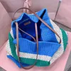 Classic designer tote bag Woven fabric vibrant color-block pattern animates this crochet handbag embroidered lettering shoulder bag leather handles