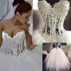 2019 erstaunliche Ballkleid-Hochzeitskleider, herzförmiges Korsett, durchsichtig, bodenlang, Prinzessin-Brautkleider, Perlenspitze, Perlen, individuell, 290 l