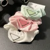 Modedesigner Damen Haargummibänder Haare Scrunchy Ring Clips Elastic Triangle Letter Sports Dance Scrun Haarschmuck