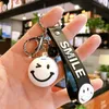 Keychains Lanyards Cartoon Smiley Keychain Cute Smile Fashion Men And Women School Bag Ornaments Creative Small Gifts Car Accessories J230724
