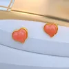 Brincos de tachas YDGY banhado a ouro genuíno e prata agulha anti-alérgico em forma de coração moderno pêssego
