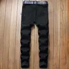 Jeans masculinos rasgados de grife jeans slim fit hip hop elásticos bordados rosas modernos calças jeans pretas azuis L230724