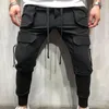 Męskie spodnie jesienne sprin Summer Casual Male BI Size 3xl Multi Pocket Dżinsy oversize kombinezon elastyczna talia plus mężczyźni