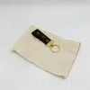 Роскошные кошельки для брелок с многоцветным дизайнером Key Ring Men Women Dragonne Gold Prentted Printed