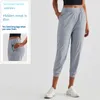 Lu-0009 Designer Slim-fit broek Slanke slanke zonnebrandcrème Casual sportbroek Vrouwen Hoge taille Zak Losse cropped broek Flanging Leggings