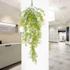 Decoratieve bloemen Faux Greenery Garland Kunstmatige hangende wijnstokachtergrond Nepbladeren Wijnstokken Lange klaverplant Bloemenarrangement voor muur