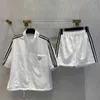 Summer women's striped stand collar short sleeve and elastic shorts set, polyester fabric is soft and comfortable, loose casual daily fashion.