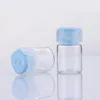 香水ボトル20pcs 3ml 5ml 10mlポータブルガラス香水ボトル空のエッセンシャルオイルボックスフリップカバー付き液体ガラスボトル230724