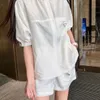 Summer women's striped stand collar short sleeve and elastic shorts set, polyester fabric is soft and comfortable, loose casual daily fashion.