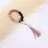 Wholesale food grade silicone beads wrist keychain alloy cap PU leather tassel keychain female multicolor optional DF067