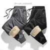 Męskie spodnie marka męskie zimowe spodnie swobodne spodnie jagnięcy wełniane spodnie elastyczne talia rozciągające spodnie haremowe plus rozmiary 4xl grube ciepłe spodnie czarne szare Z230726