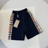 Nouvel été classique plaid côté shorts pantalons pantalons version coréenne de la mode décontractée vêtements pour enfants pantalons de style étranger.