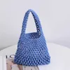 Bolsas de ombro Nova bolsa de rede vazada Bolsa de corda de algodão feito à mão de cor sólida Bolsa de pulso Bolsa de balde de férias de praia Bolsa feminina