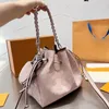 LVITY LVSE High Out Calfskin Leather Quality Woman Designer Hollow Mini Drawstring Bucket Bag med rund myntplånbok Stickband Lady Shoulder Handbag Luxury Pur