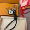 مصمم سلسلة مفاتيح الفاخرة سحر Women Classic Car Keychain Alphabet Keyring Men Handmade Roped Rope Keychain Gift 2307265BF