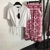 Womens mode Tvådel t-shirt tryckt långa klänning set smala slips midja kort ärm tee vintage blommig tryck mid-längd veckad kjol klassisk designer kvinnor kläder