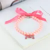 Colliers pour chiens Imitation perle collier pour animaux de compagnie collier ornement strass os pendentif avec ruban pour cadeaux cinq couleurs disponibles