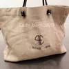 Borsa grande da spiaggia di nicchia Borsa firmata da spiaggia Borsa di tela fatta a mano con alghe intrecciate alla moda Borsa di lusso Borse da esterno di grande capacità per donna e uomo