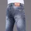 Jeans masculinos designer de luxo mens jeans designer primavera e verão fino ajuste elástico pequenos pés versão na moda menino calças GIKS