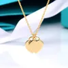 Brand de créateur Love Double Heart Tiffays Collier Womens Seiko Version en acier Sceau de joint en forme de cuivre blanc électroplate 18k Chain d'or réel