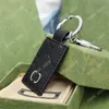 Клайф -мачины мужчины дизайнеры Classicain Classic Letter Car Key Chain Womens Fashion Bag Bug Brand Gold Buckle
