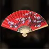 Produtos de estilo chinês 50cm estilo chinês grande ventilador dobrável vermelho usado para decoração de parede de casamento família sala de estar plano de fundo ventilador de papel série artesanal
