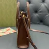 2024 New Designer women's crossbody shoulder Genuine Leather Music Casual Versatile Old Flower Mini Tote WomensB agO nes houlderm bag