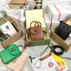 새로운 럭셔리 2023 공장 직접 판매 고품질 버클 카라멜 베이지 색 대나무 공동 휴대폰 가방
