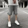 Pantaloncini da uomo Summer Checkerboard Loose Casual Coulisse Tasche da uomo High Street Pantaloni oversize larghi a cinque punte