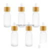 Förpackningsflaskor Frosted Clear Glass Droper Bottle With Bamboo lock Kosmetiska förpackningsglasögon Liquid Containers Drop Delivery Office S OTPMZ