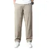 Męskie spodnie Mężczyźni proste luźne kieszenie Multi Pockets Solidny kolor Mid tali