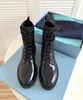 2024 Winter Perfect Brands Brushed-leather Ankle Boots Black Re-Nylon Recycled Enameled Metal Triangle Booties Monobloc sole Combat Booty