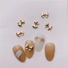 Nail Art Decorations 100PC Mini Lovely Bowknot Nail Art Decoration Retro Gold Chrome Bow-tie Alloy Charms 3D Butterfly Knot Parts Fingertips Ornament 230729