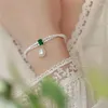 Ras du cou Minar Dainty blanc coquille naturelle vert CZ Zircon collier de perles pour les femmes Double couche perle d'eau douce